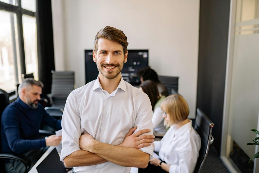 Businessman with arms crossed and shows leadership