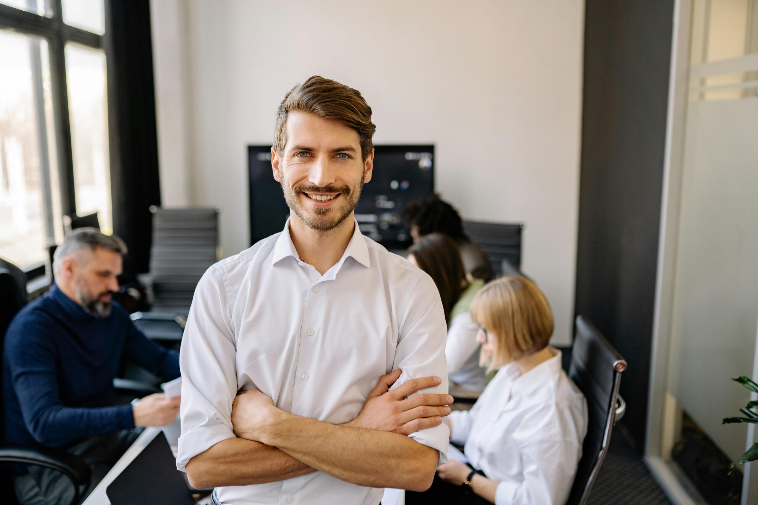 Businessman with arms crossed and shows leadership