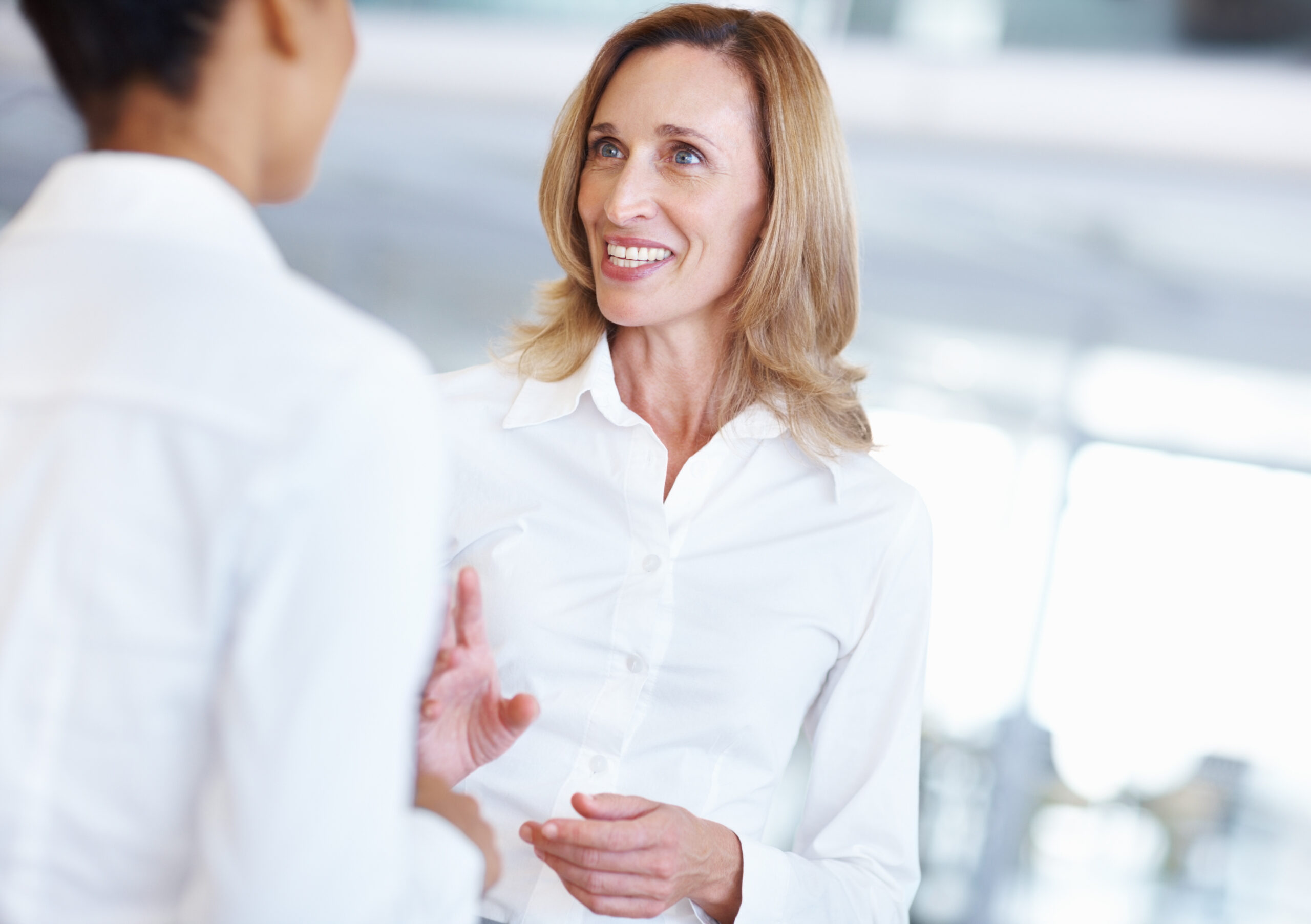 A customer acquisition strategist talking to another person